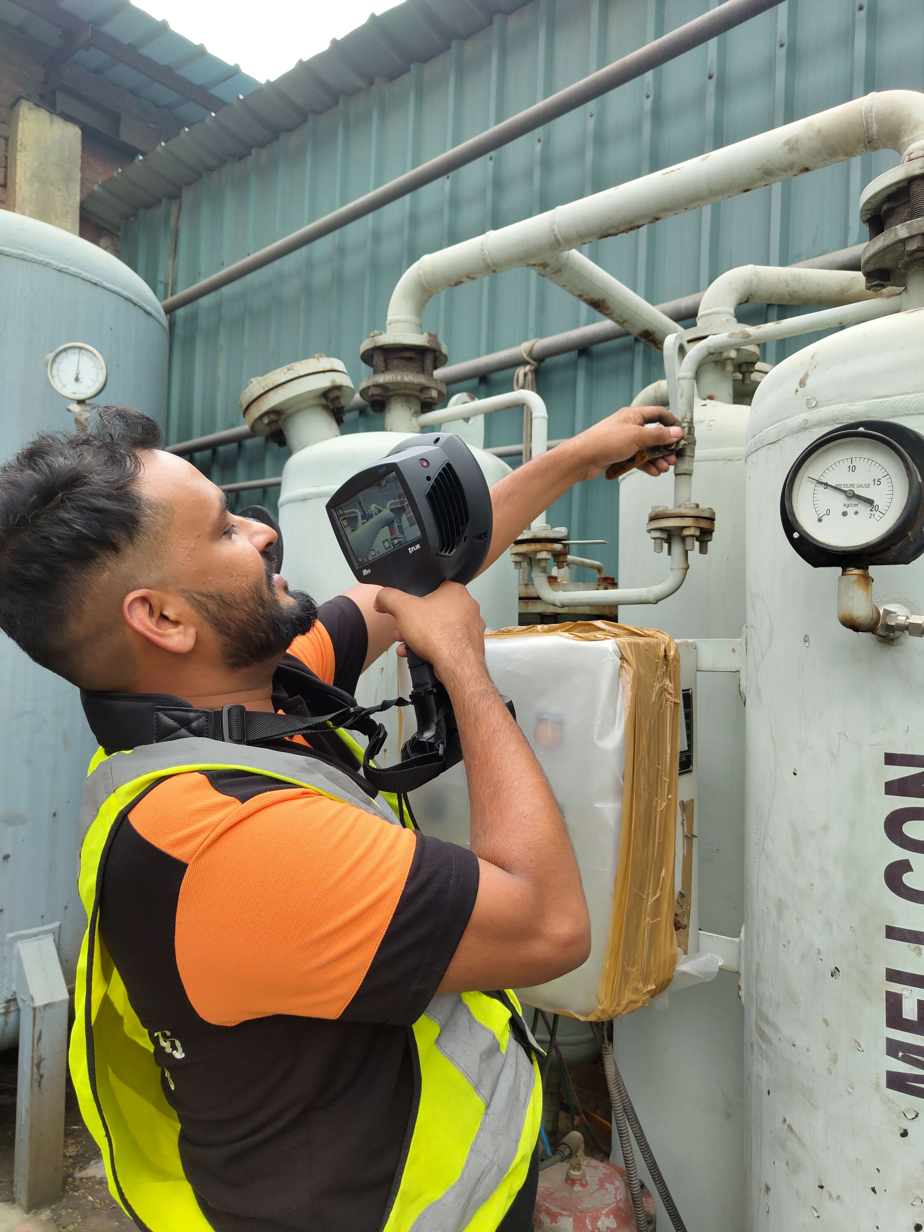 Team conducting ultrasonic leak detection